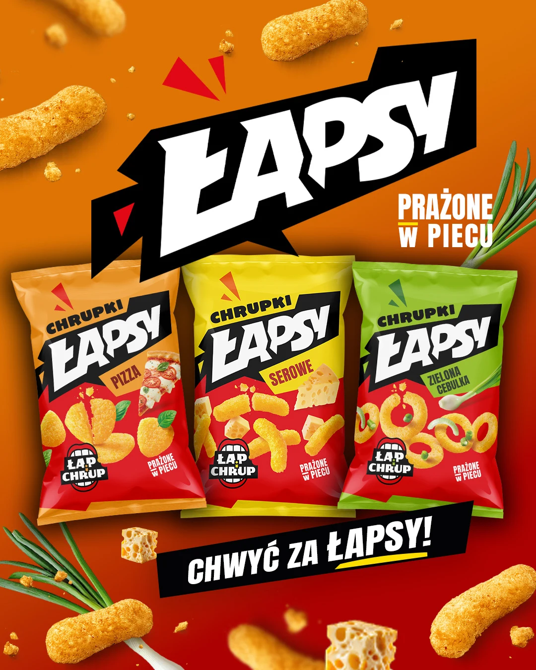 Kreacja reklamowa Łapsy: kompozycja trzech opakowań na pomarańczowym tle